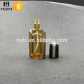 Bouteille de parfum de pompe en verre ambre de forme unique de 100ml pour le mâle